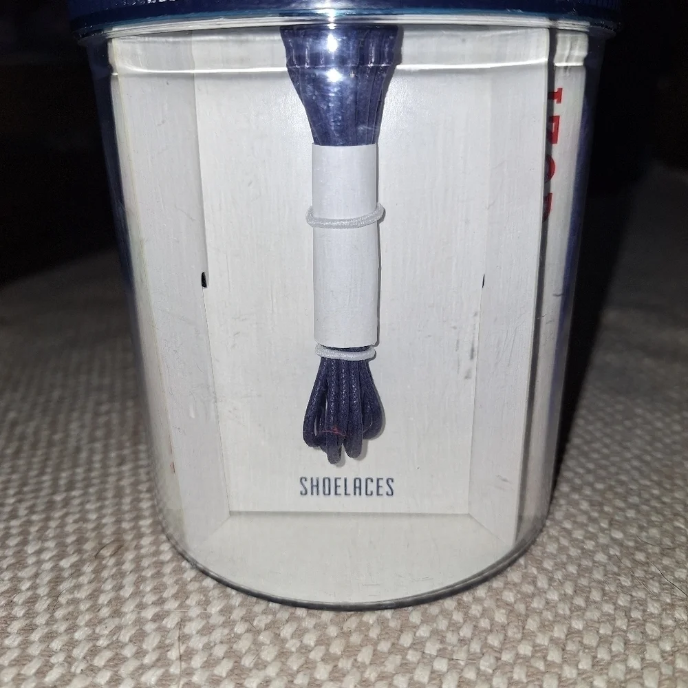 An Izod 3 piece men must have style set with a bowtie, shoestrings, handkerchief